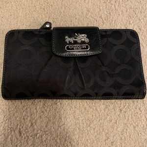 Coach black snap front wallet. Pink inside.